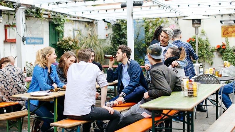 Sip on cold drinks year-round in The Crown and Shuttle's beer garden. Credit: The Crown and Shuttle. Image courtesy of The Crown and Shuttle. A group of customers enjoy a chat in the Crown & Shuttle's beer garden. Image courtesy of Crown & Shuttle.