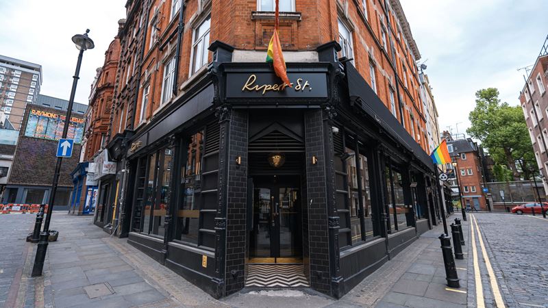 Book tickets to drag cabaret or DJ nights at Rupert Street Bar in Soho. Credit: Shutterstock. Image courtesy of Shutterstock. A photo of the exterior of Rupert Street Bar in Soho with and LGBTQ+ flag hanging above the entrance