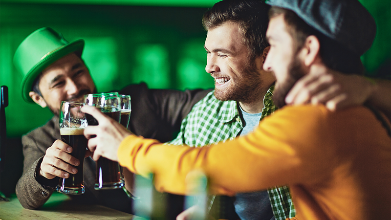 Celebrate St Patrick's Day with friends in one of London's irish pubs. Credit: Shutterstock. Image courtesy of Shutterstock. A group of friends cheers to St Patrick's Day