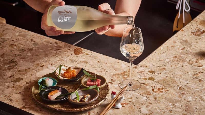 Experience Japanese fine dining at Humble Chicken and enjoy a selection of Izakaya favourites. Credit: Humble Chicken. Image courtesy of Humble Chicken. A plate featuring a selection of Japanese tapas is disposed on a counter at Humble Chicken, a Michelin star restaurant in London.