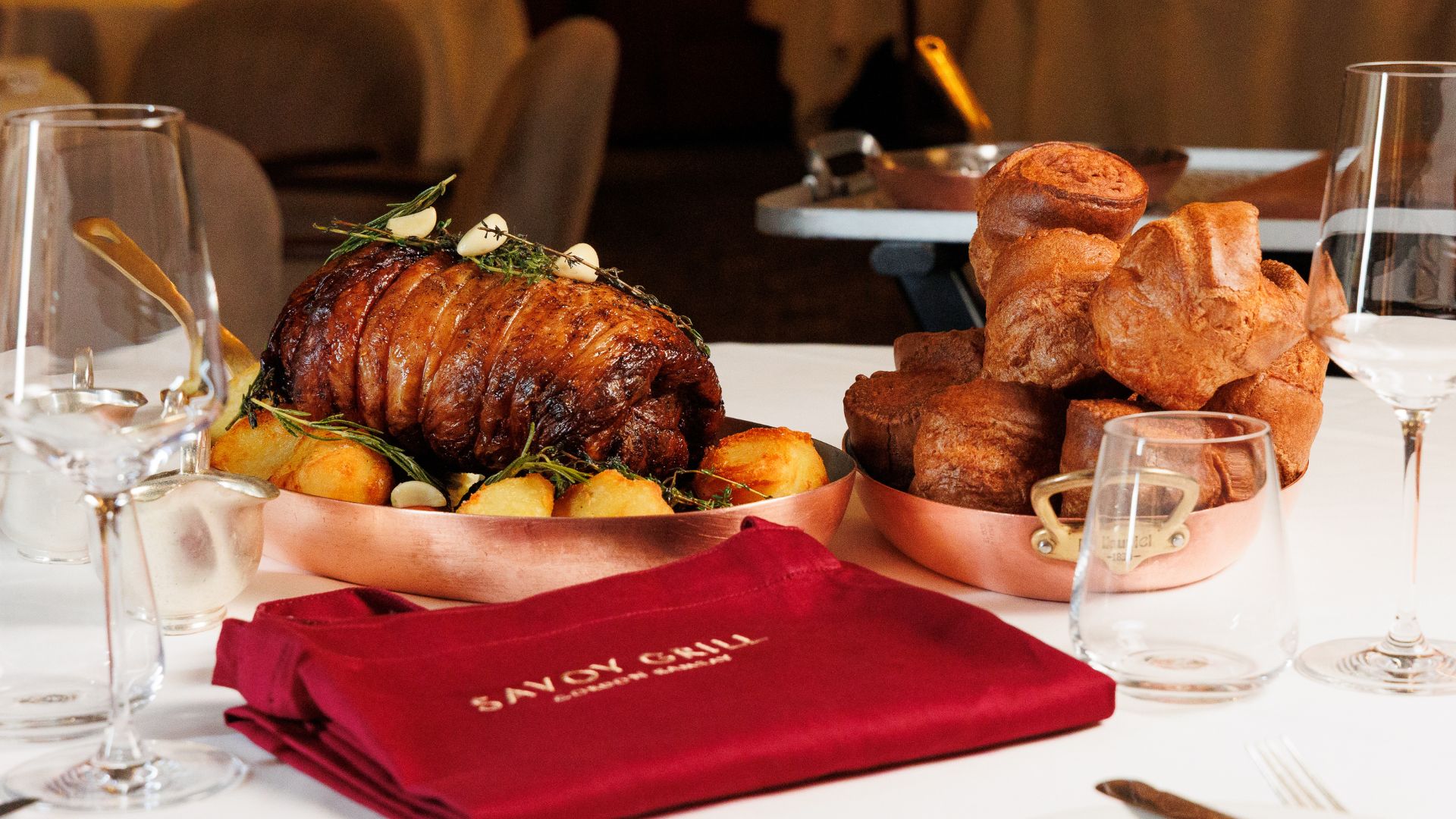A premium Sunday roast at Savoy Grill featuring a rolled saddle of lamb, crispy roast potatoes and towering Yorkshire puddings served tableside in an elegant dining room. Image courtesy of Clementine Com. Celebrate Father’s Day with Gordon Ramsay’s theatrical Host & Roast experience at Savoy Grill, where dads can carve a premium saddle of lamb tableside alongside all the classic Sunday roast trimmings.