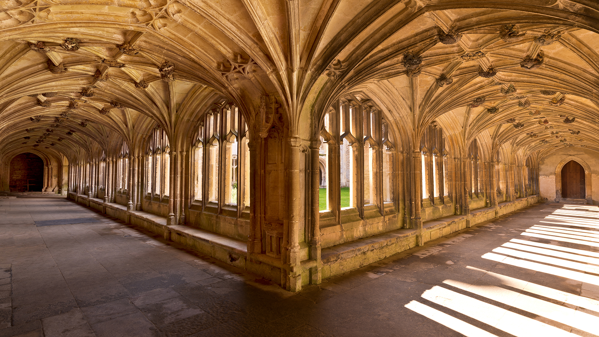 Vist Lacock Abbey. Image courtesy of Shutterstock Halls at Lacock Abbey facing the interior greenspace.