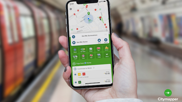 Navigate London transport with Citymapper. Image courtesy of Citymapper. Person holding their phone showing the Citymapper app in a London Underground station