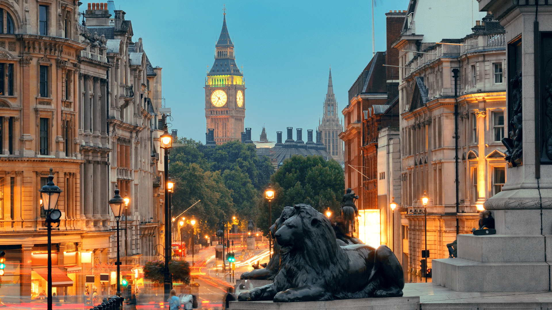 Lion statues in Trafalgar Square with view of Big Ben in the background