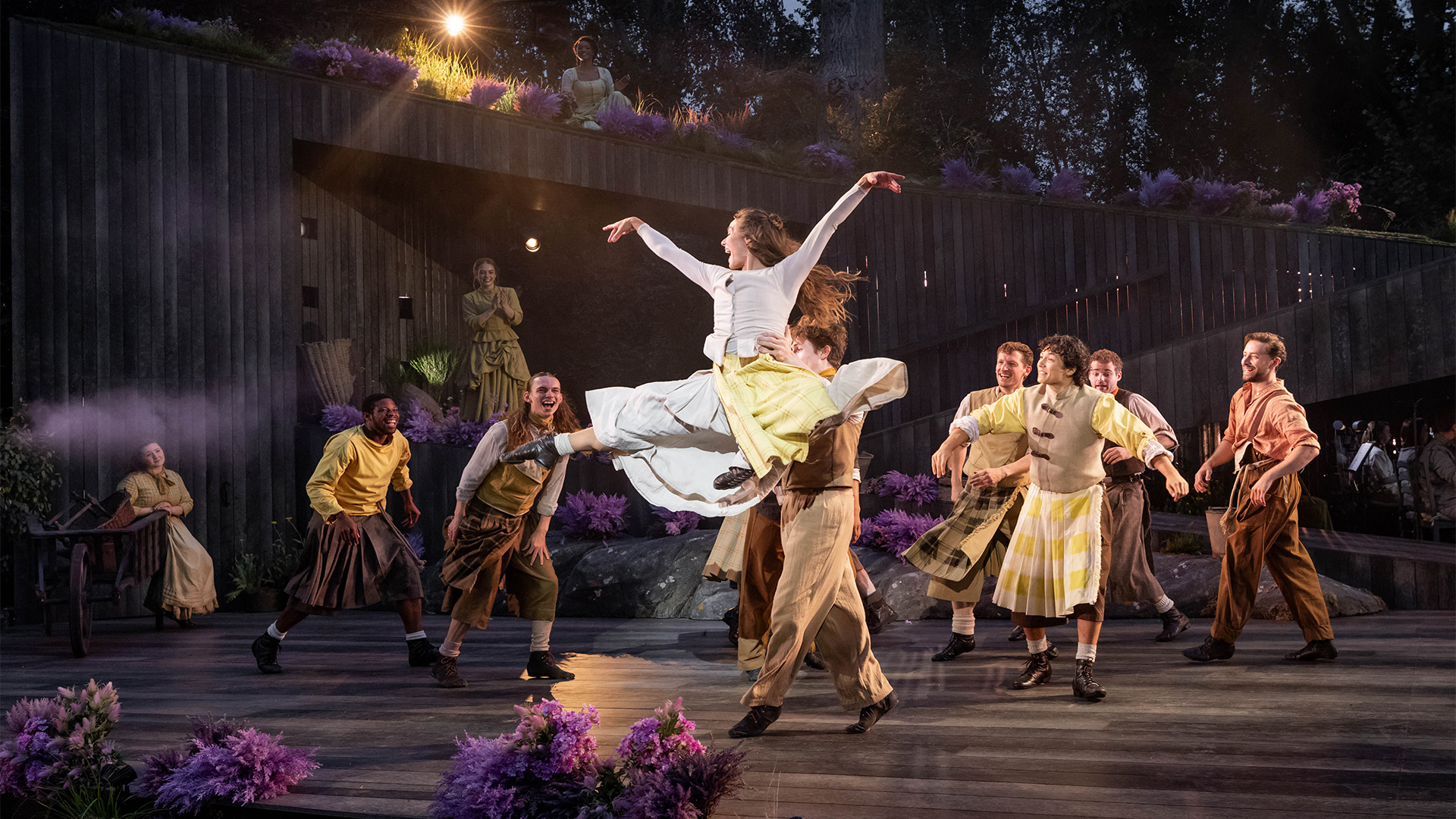 Danielle Fiamanya and Georgina Onuorah share the lead of Fiona in Brigadoon. Image courtesy of London Theatre Direct/Mark Senior. The cast of Brigadoon dance in the opening scene