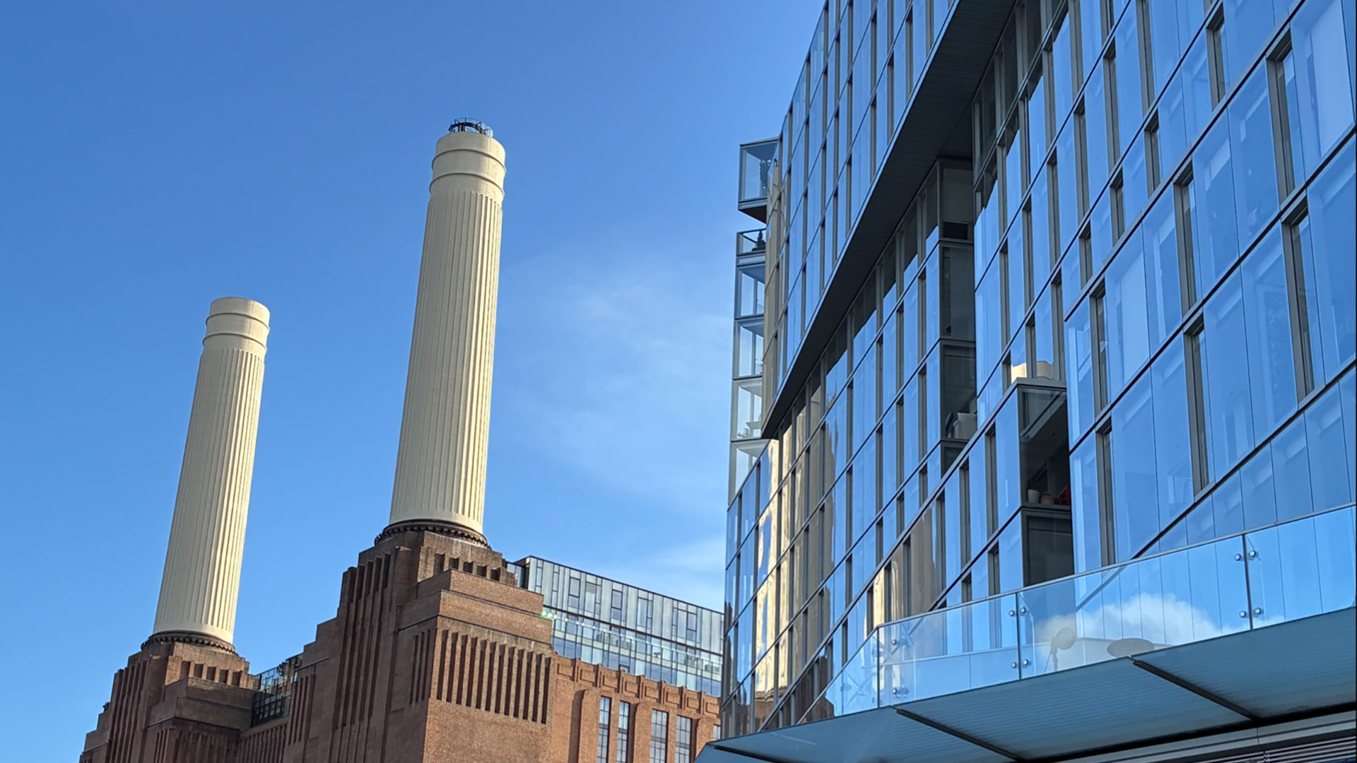 The incredible Chimney Lift at Battersea Power Station © Chantal Welch. Image courtesy of Chantal Welch. Battersea Power Station on a sunny day with The Chimney Lift in view