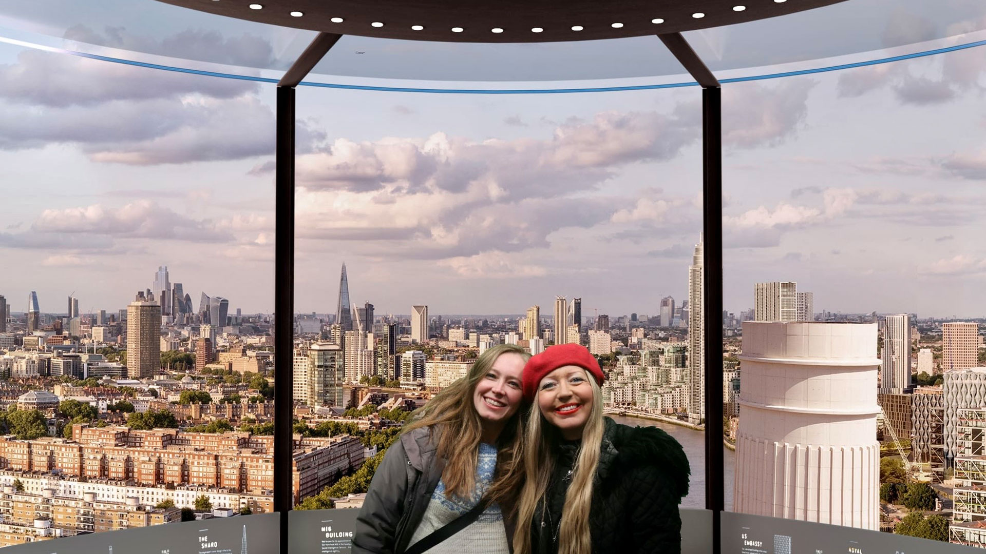 Two women in the glass lift at Battersea Power Station with views of London in the background