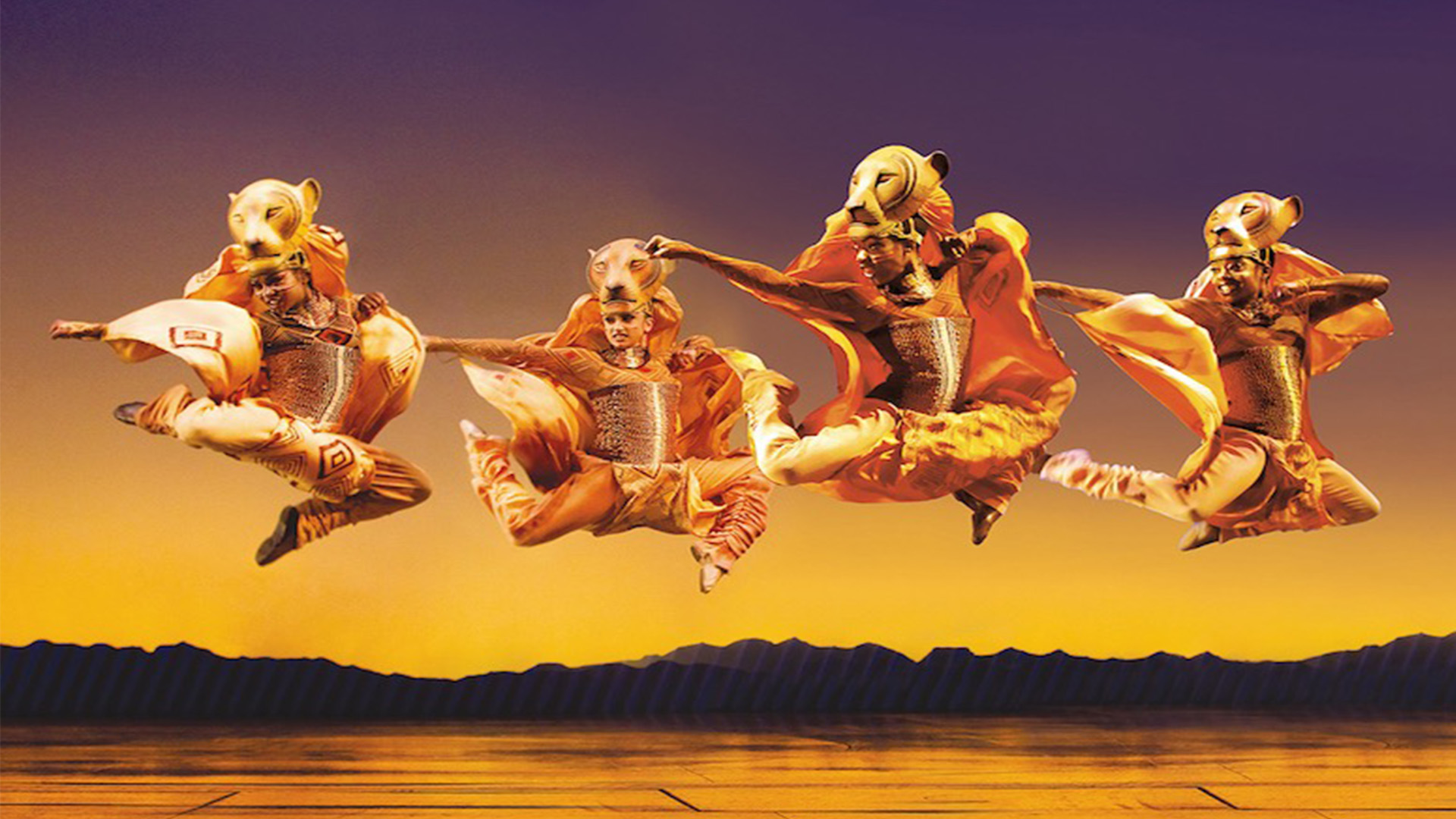 Lionesses leap across the stage in Disney's The Lion King. Image courtesy of London Theatre Direct/Johan Persson. Lionesses leap across the stage in Disney's The Lion King