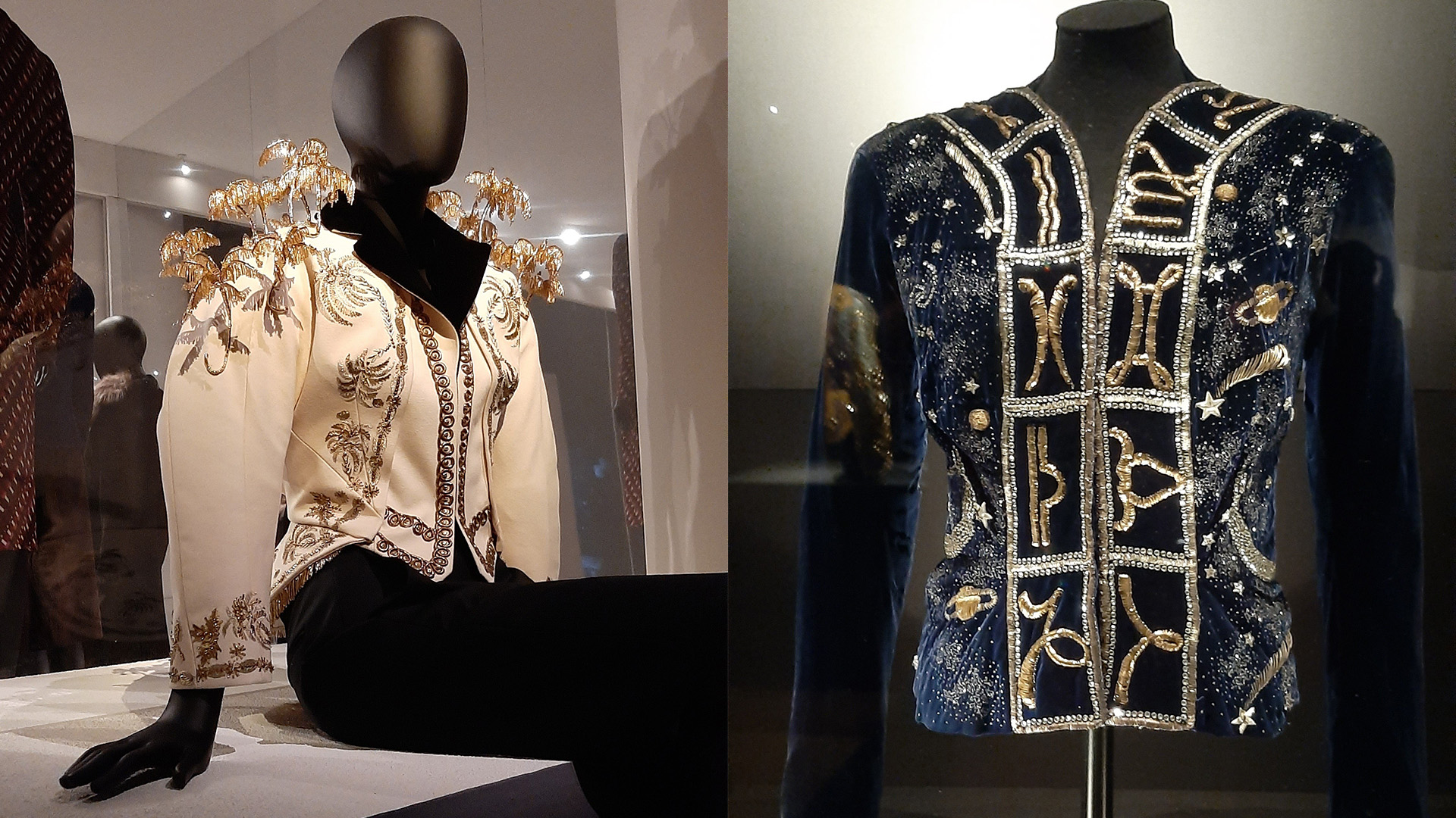 On the left a cream coloured blazer with golden palm embroidery sticking out of the garment and on the right a dark blue blazer with star and planet and star sign embroidery in silver and gold.