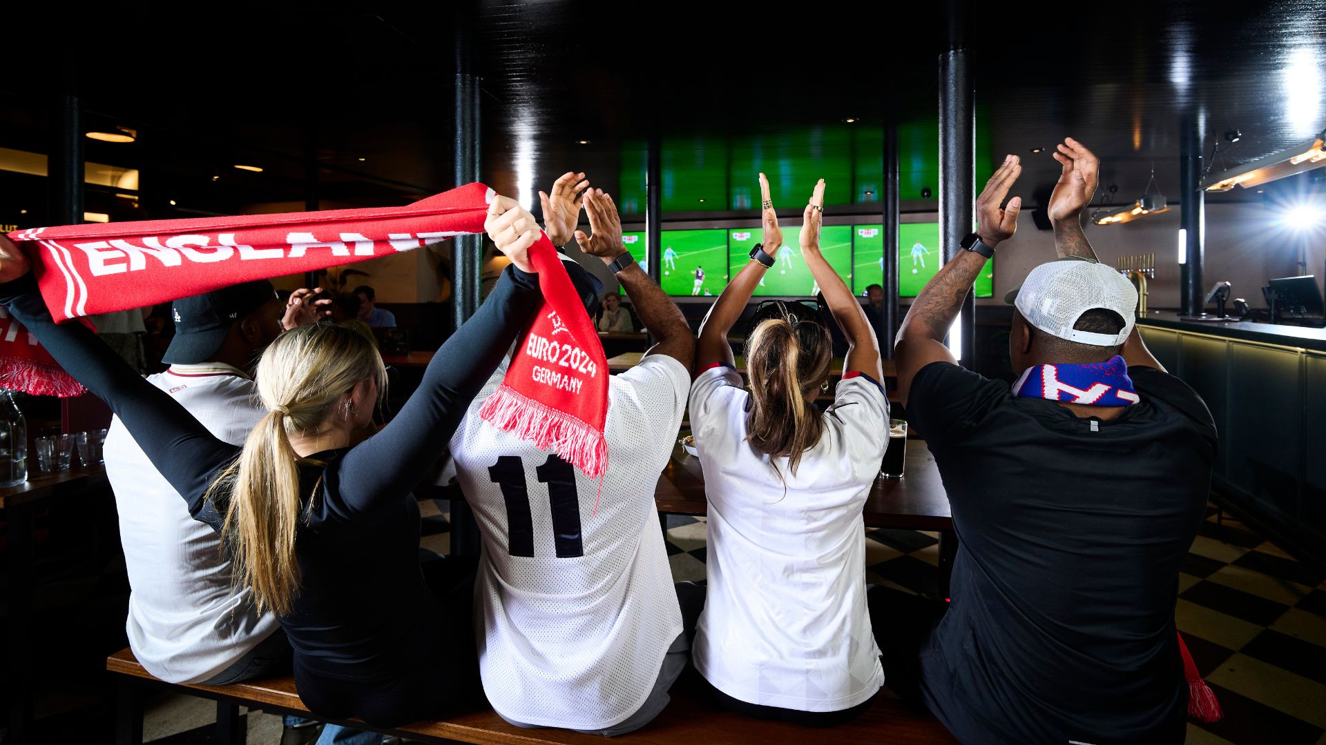 Discover the best viewing spots in London in 2026 for the FIFA World Cup. Image couresty of The Fitting Room. Football fans watch a live match on big screens inside BOXHALL Liverpool Street.