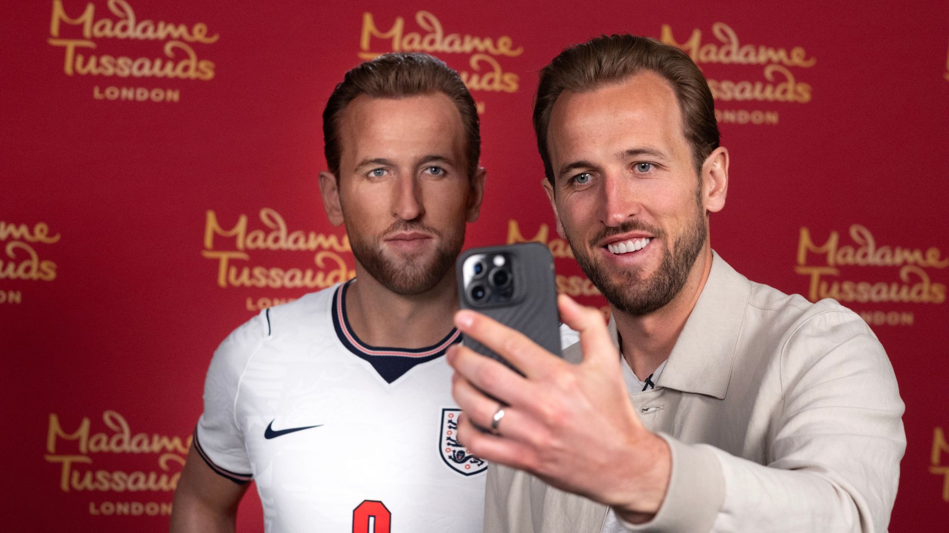 Harry Kane poses for a selfie alongside his wax figure at Madame Tussauds London.
