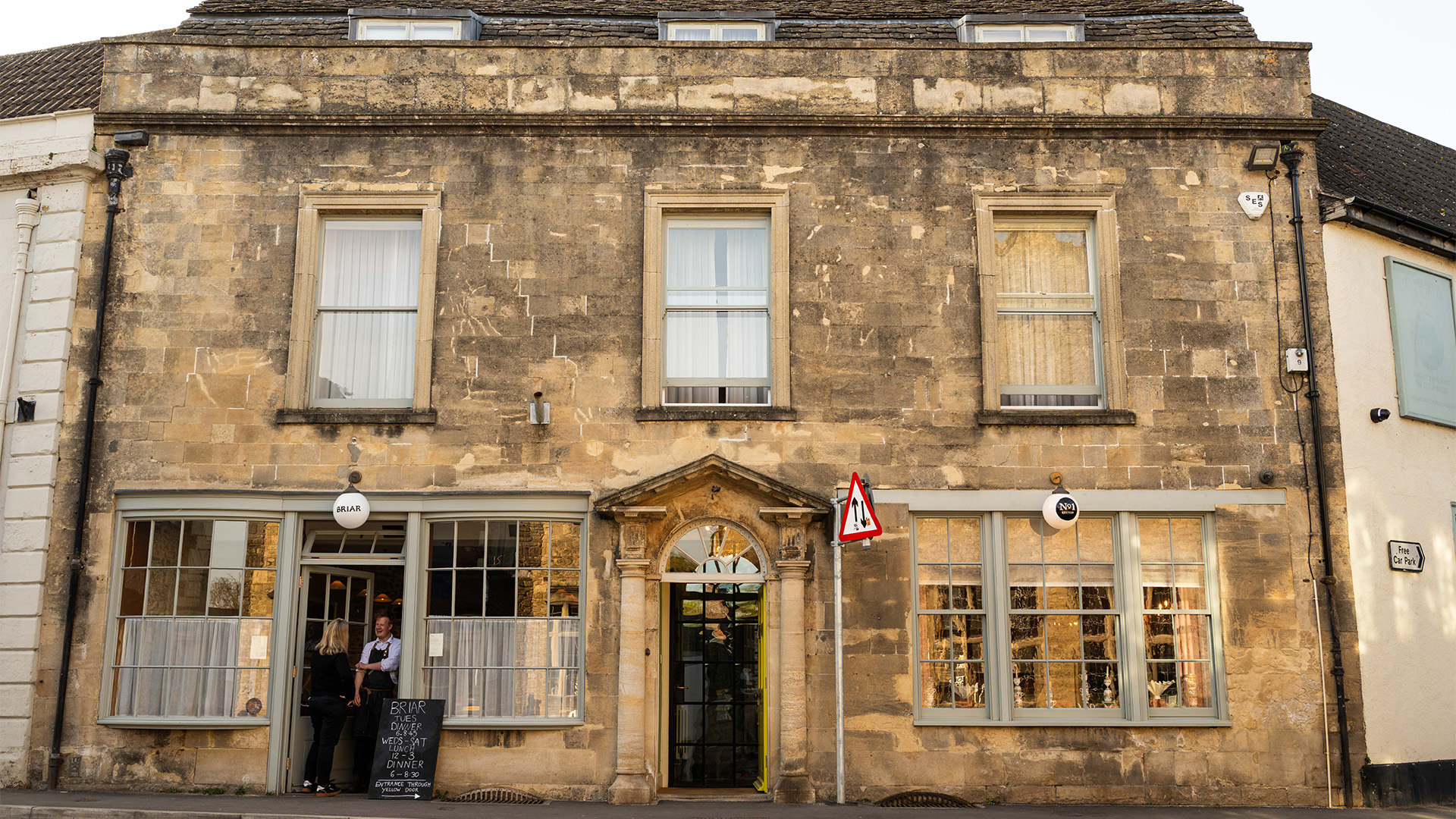 Chalkboard menus line the sandstone exterior of Briar restaurant 