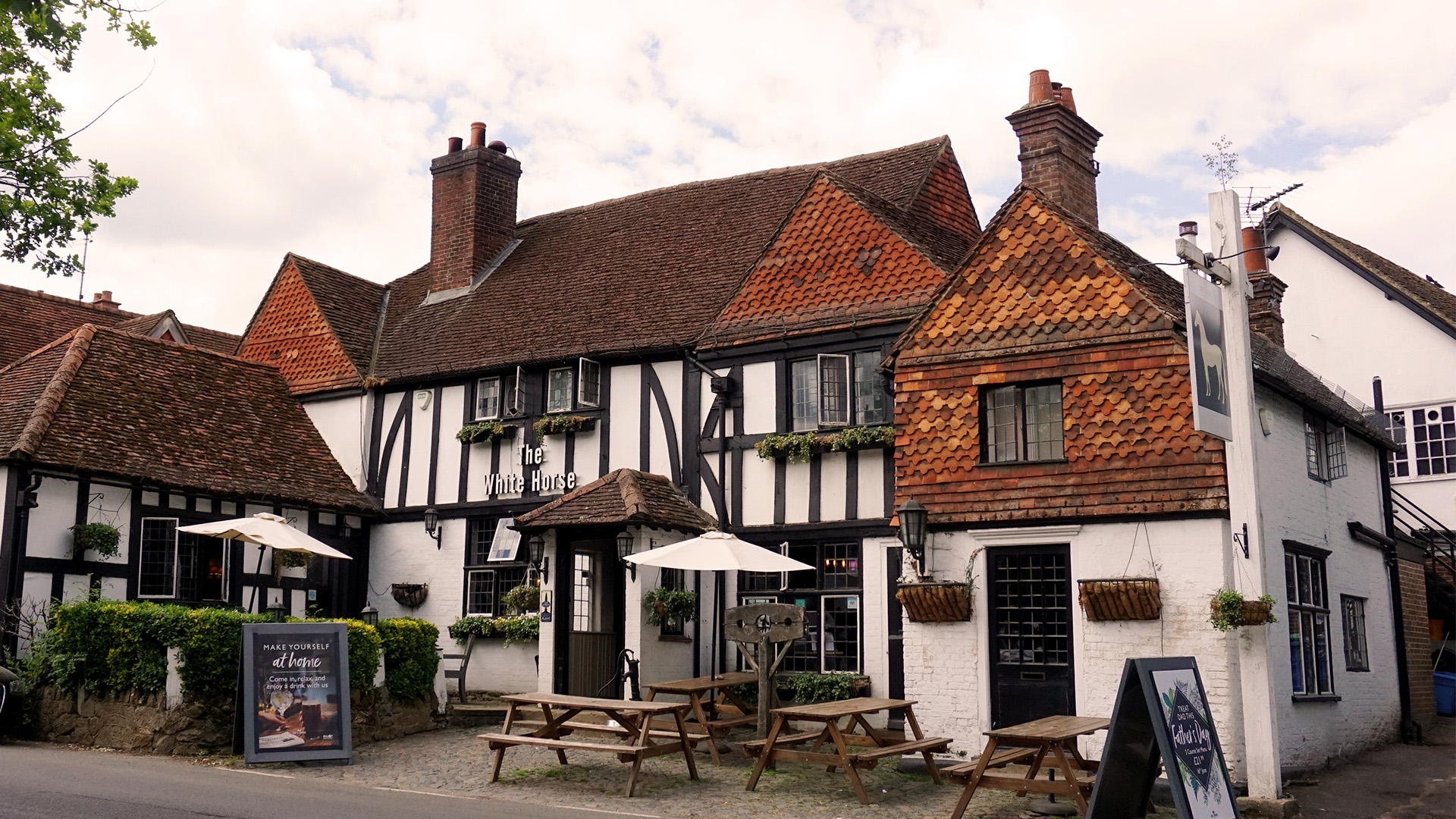 Exterior of The White Horse pub in Shere, Surrey.