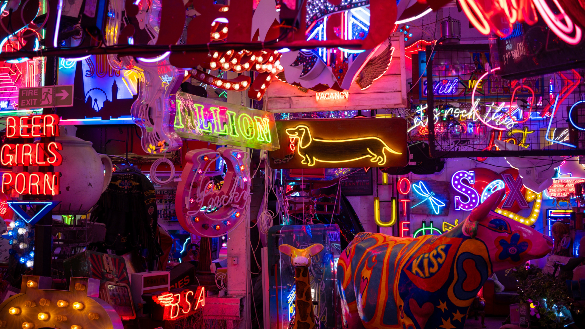 A photo of many brightly colour neon lights and signs at God's Own Junkyard