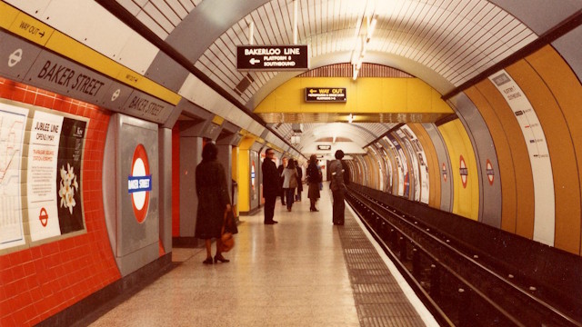Baker Street underground station, Jubilee line platform, 1979 © TfL from London Transport Museum's collection. Image courtesy of TfL. A view along the Jubilee line platform at Baker Street in 1979, with the tracks, platform, signage and people.