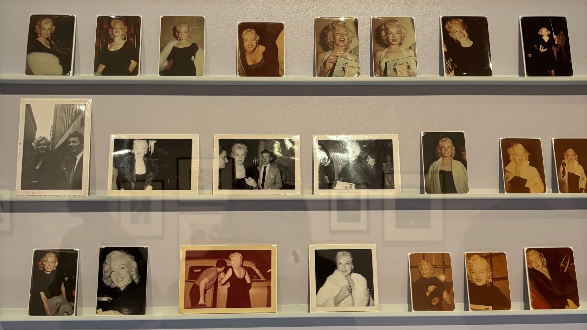 Film pictures lined on wall in the exhibition Marilyn Monroe: A Portrait at the National Portrait Gallery, London.