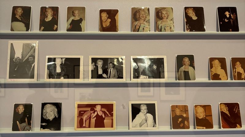 Marilyn Monroe: A Portrait at National Portrait Gallery. © Visit London/Charlotte Pritchard. Film pictures lined on wall in the exhibition Marilyn Monroe: A Portrait at the National Portrait Gallery, London.