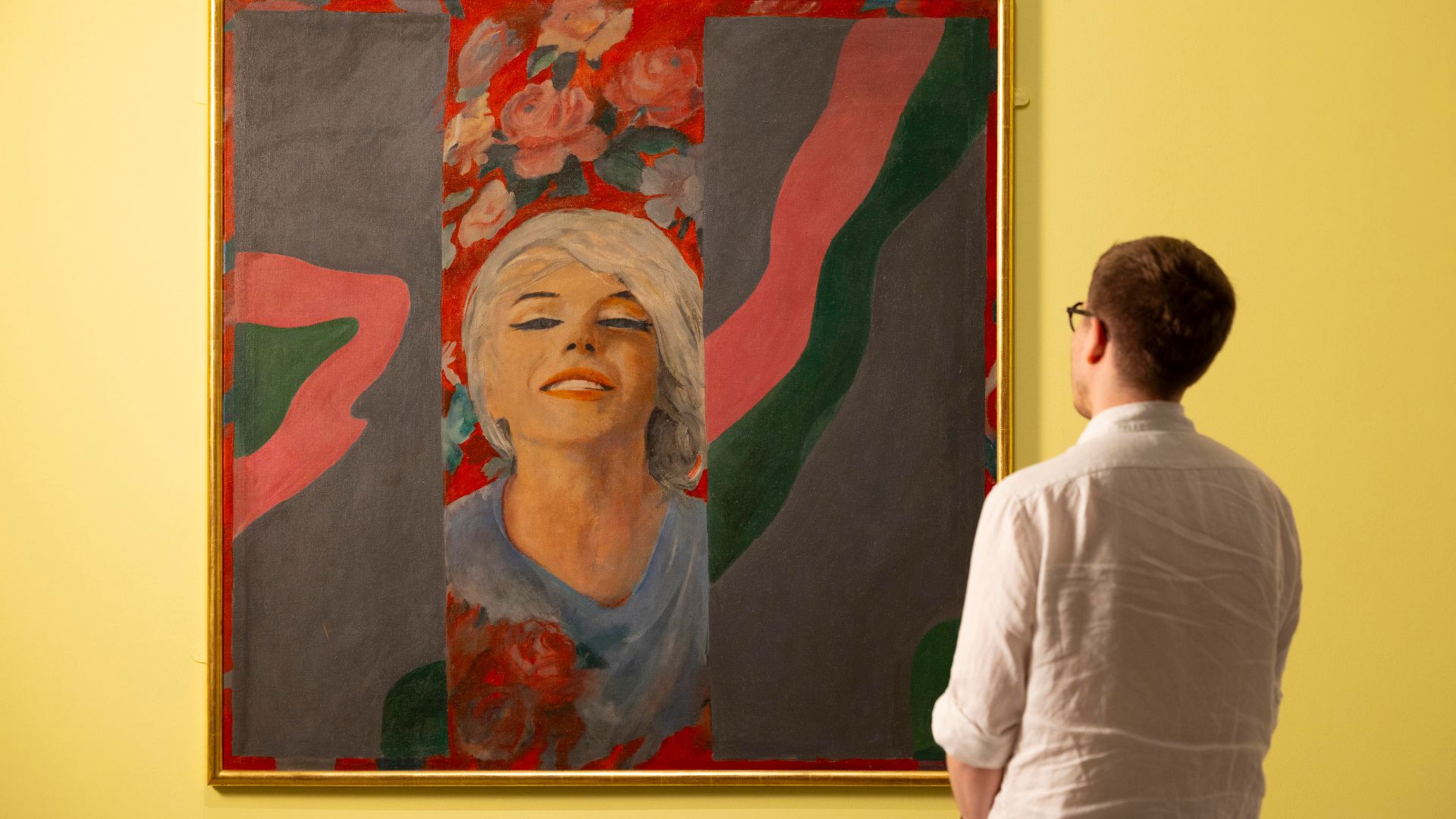 A visitor observing Colour Her Gone, 1962, by Pauline Boty, in the exhibition Marilyn Monroe: A Portrait at the National Portrait Gallery, London.