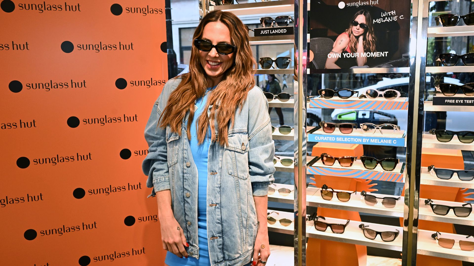 The former Spice Girl took to the decks for a surprise DJ set as part of Sunglass Hut's OWN YOUR MOMENT campaign in Covent Garden. Image courtesy of Canoe Inc. Melanie C DJs at the Sunglass Hut OWN YOUR MOMENT pop-up in Covent Garden, performing behind the decks while wearing oversized mirrored sunglasses.