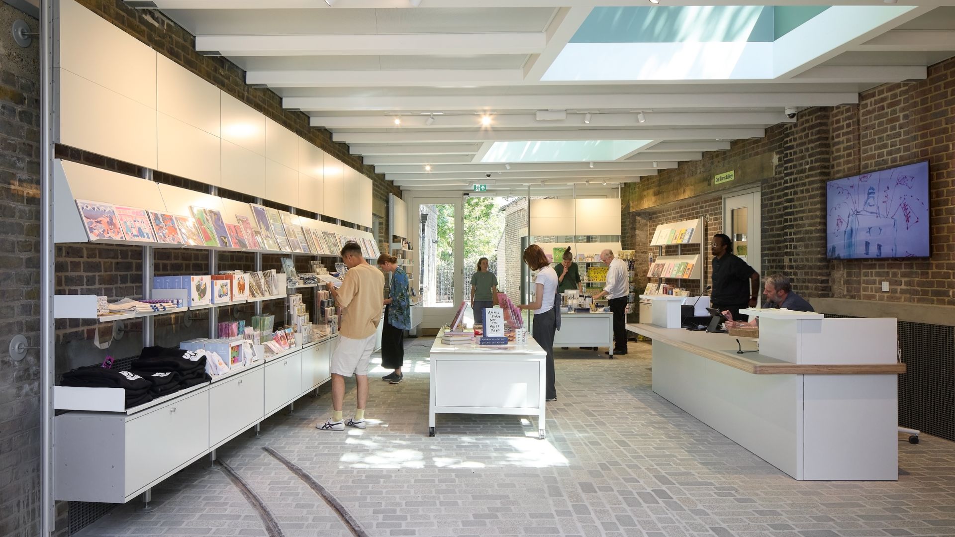 Visitors browse books, prints and gifts inside the Quentin Blake Centre shop, housed within the restored New River Head waterworks.