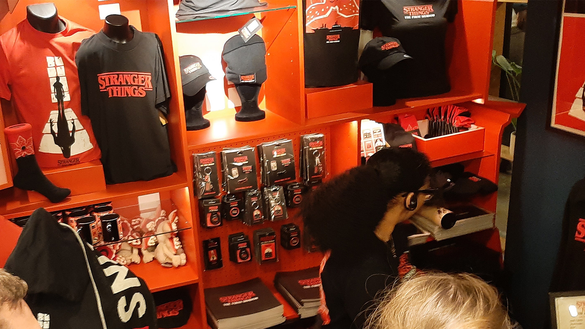 Get you merchandise for Stranger Thing: The First Shadow at The Phoenix Theatre. Image courtesy of Sigrun Tomicki/Visit London People queue for merchandise including T-Shirts and hats of Stranger Thing: The First Shadow.