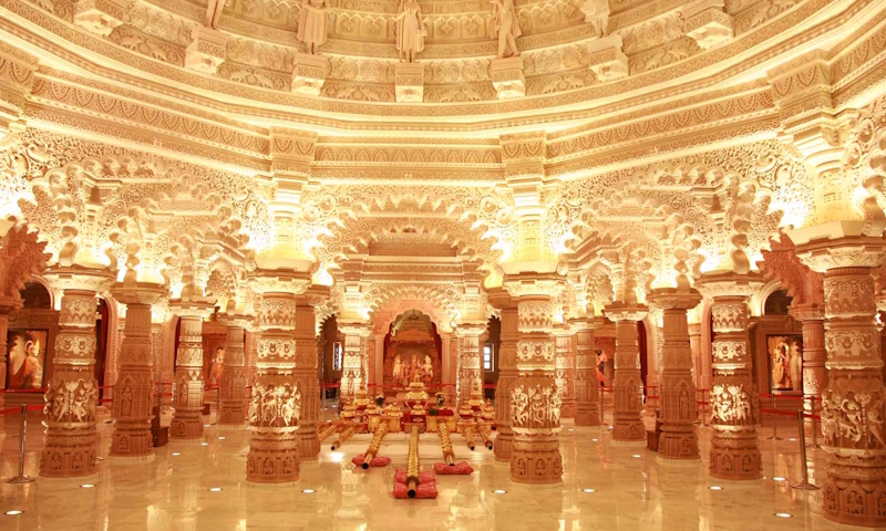 Shri Sanatan Hindu Mandir. Image courtesy of Shri Vallabh Nidhi UK. The interior of Shri Sanatan Hindu Mandir in Wembley, showing carved pillars, an ornate ceiling and marble flooring.