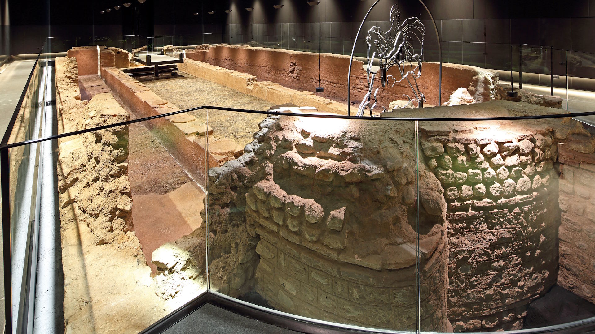 Part of the ruins of the Temple of Mithras illuminated at the London Mithraeum.