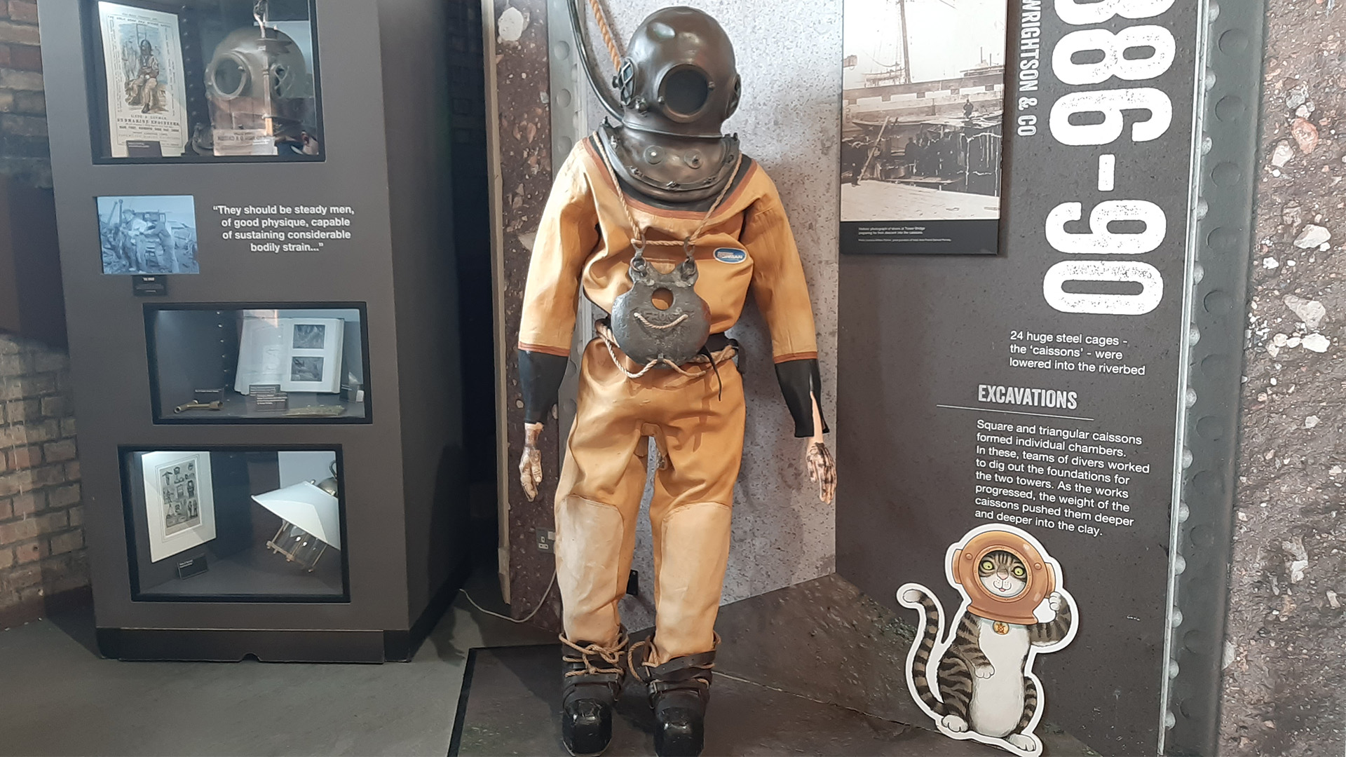 Enjoy a visit at Tower Bridge. Image courtesy of Visit London/Sigrun Tomicki A diver suit inside of Tower Bridge with additional information and other items on display.