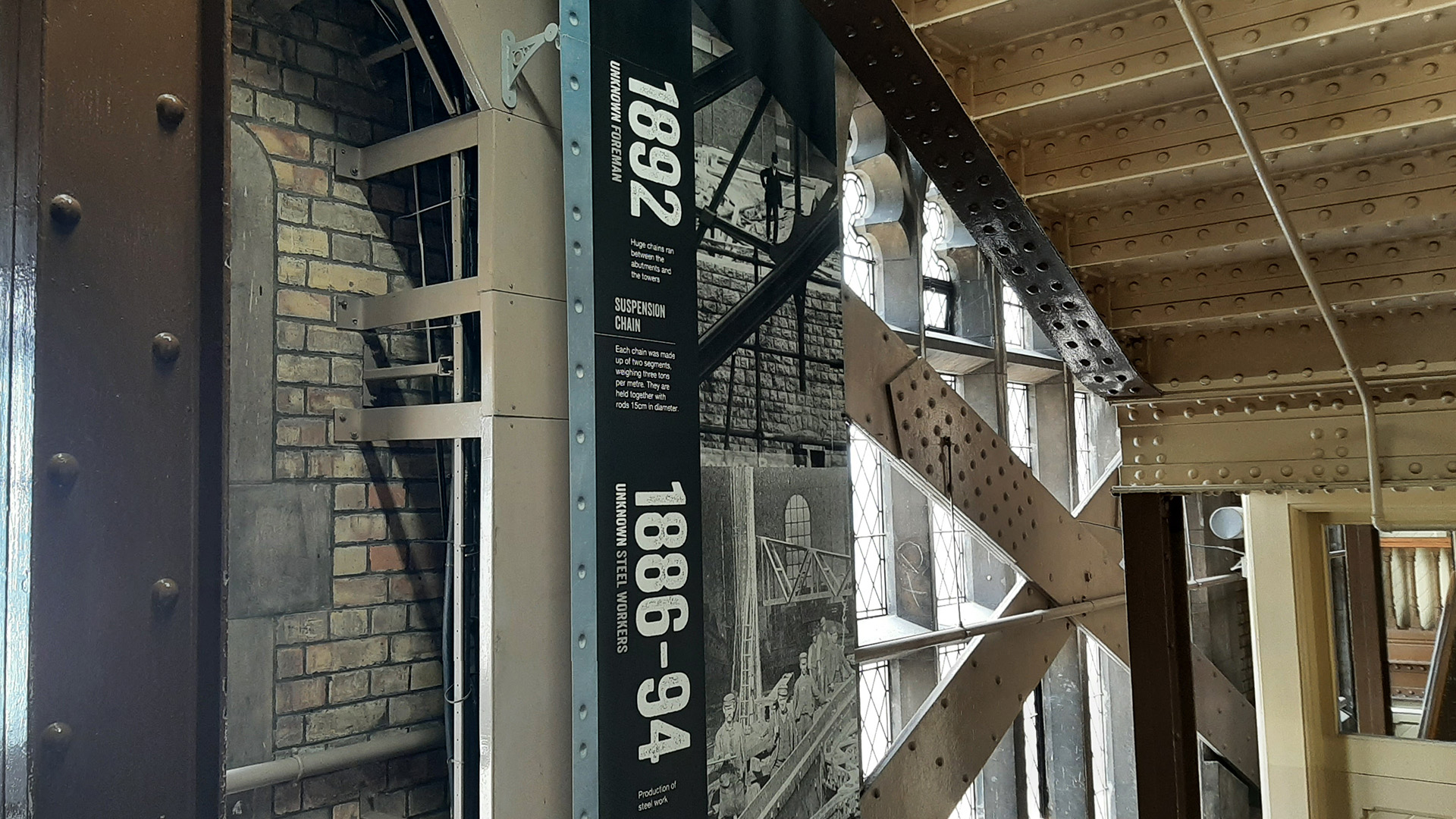 See background information inside the staircase of one of the towers of Tower Bridge and parts of the original structure.