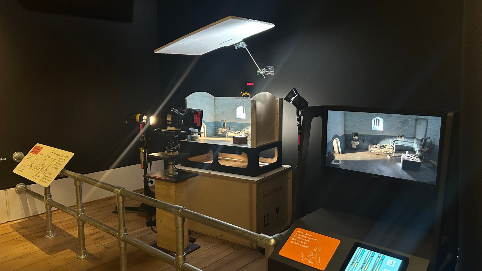 A model miniature film set takes centre stage, with stage lighting around the model. A control pad sits just out of shot, where you can adjust and play around with the colours and light intensity of the set