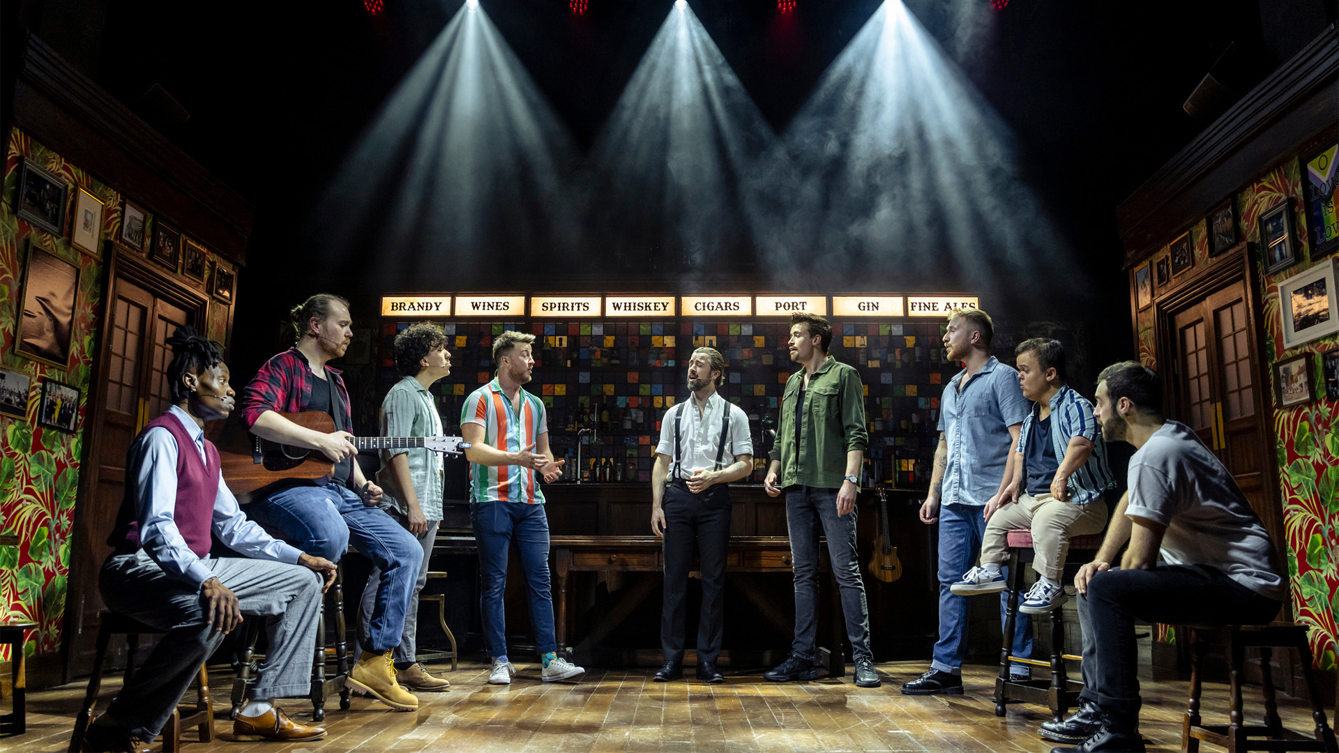 The cast of The Choir of Man against the working pub 