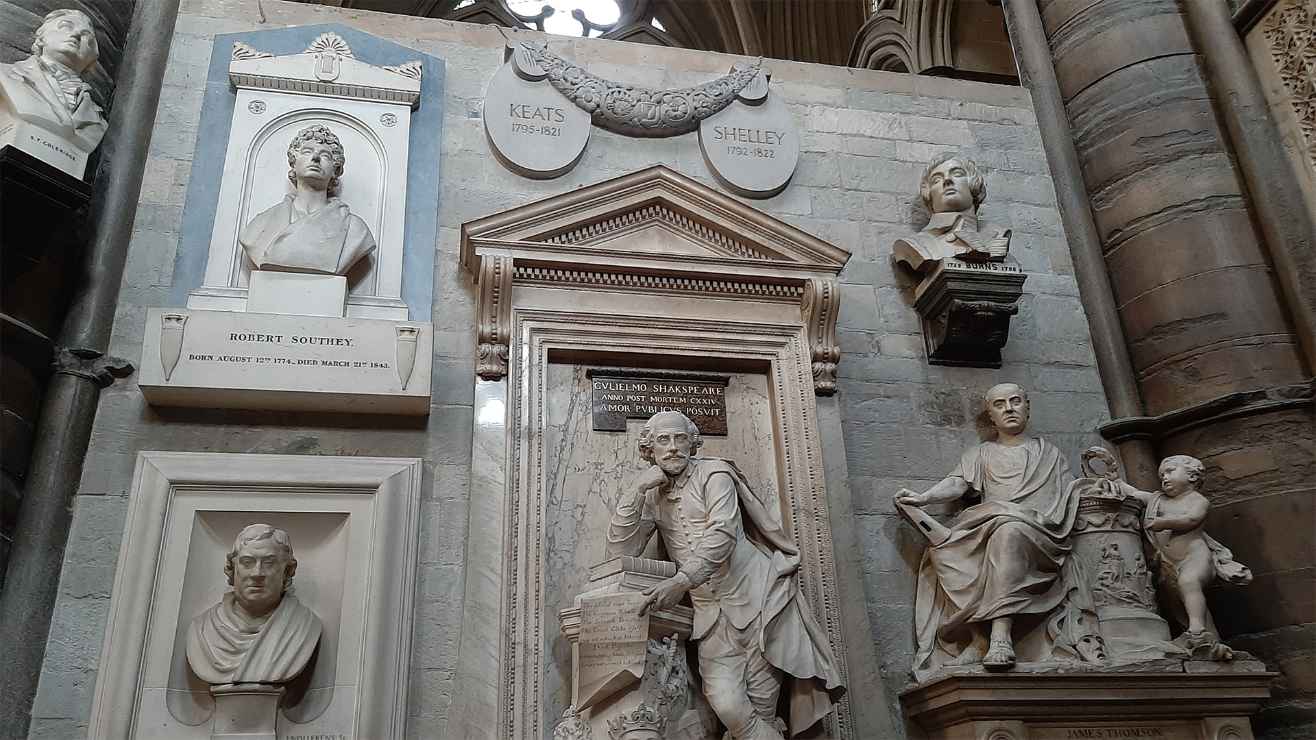 An image of the Poet's Corner including famous writers such as Shakespeare, Keats, Shelly and Burns.