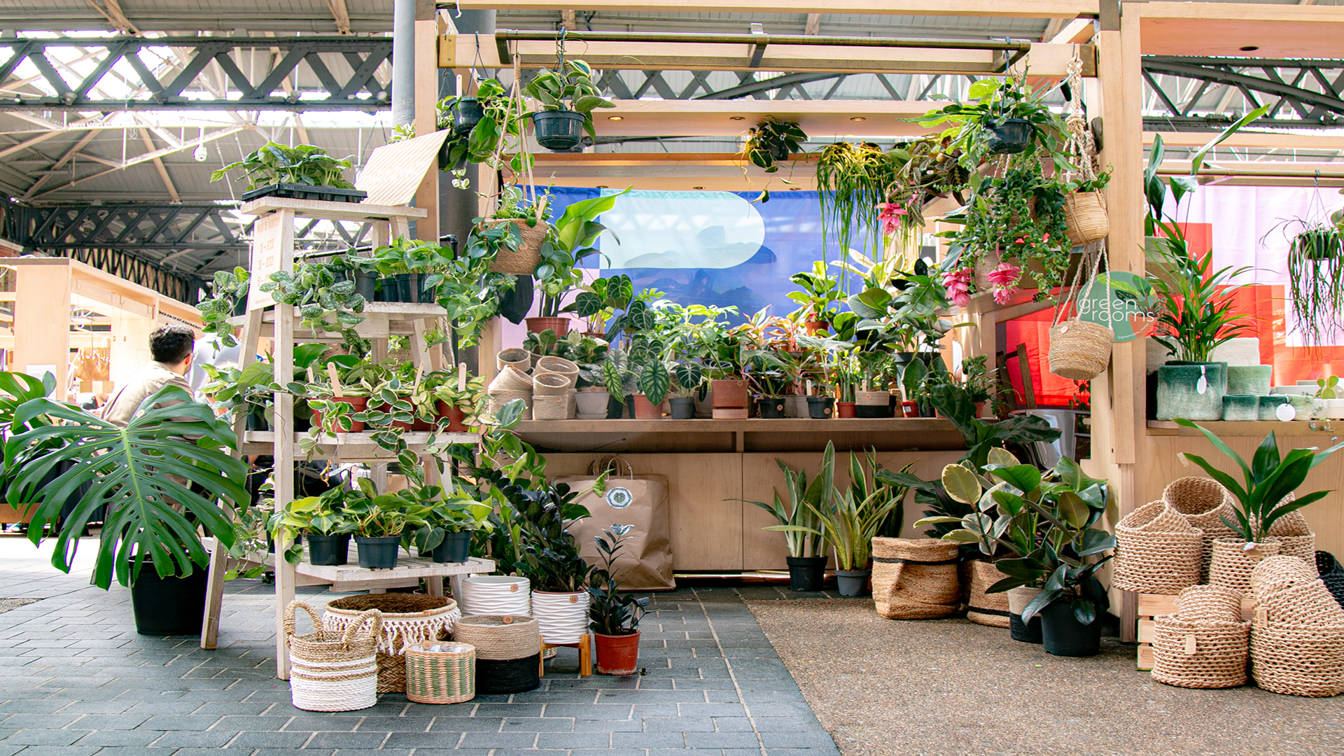 A market stand full of green plants and plant pots in Old Spitalfields market at the Green Rooms pop-up market.