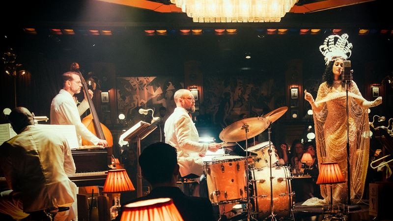 Spend an evening in a 1930s speakeasy filled with glitz and glamour at 58th Street. Credit: The Lost Estate. Image courtesy of The Lost Estate. A live band plays with a singer at the lost estate 58th street experience.