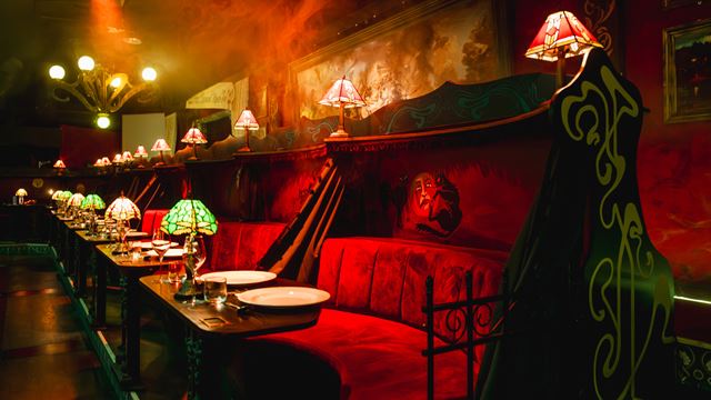 Take a look inside the immersive cabaret Chat Noir!, which features dimly lit lights, velvet cushions and dining booths that recreate the atmosphere of a daring Parisian cabaret.