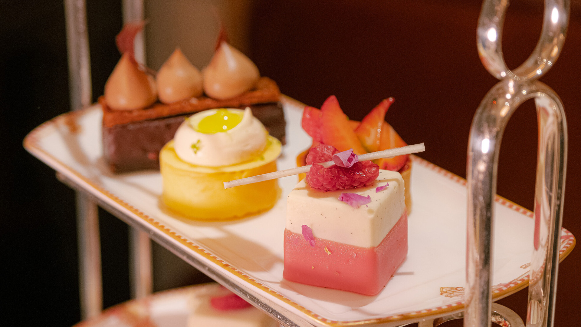 Enjoy a plant-based afternoon tea at the Savoy. Image courtesy of The Savoy. An afternoon tea plate with three different sweet treats.