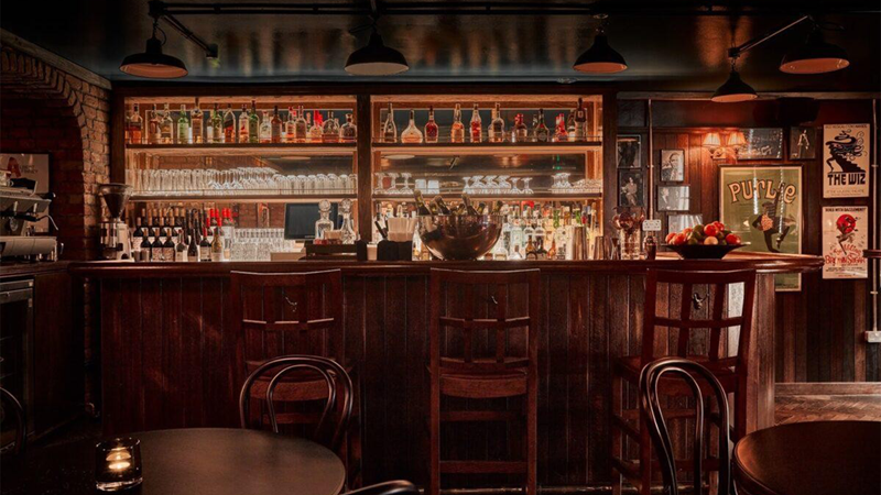 Visit Joe Allen London, a Covent Garden institution since 1977. Credit: Joe Allen London. Image courtesy of Joe Allen London. The dimly lit bar at Joe Allen London