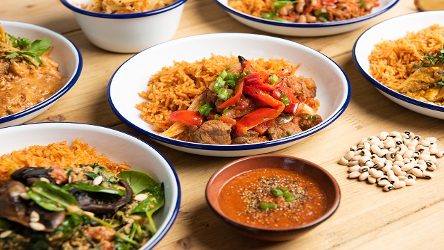 Six bowls of homemade stew, differing in size, topped with chillis and seeds