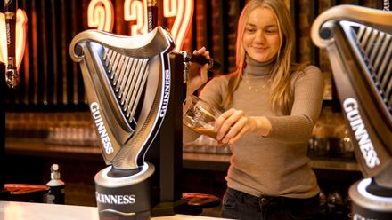 Guests get the chance to pour their own Guinness as part of the immersive brewery tour experience. Image courtesy of Golden Tours.
