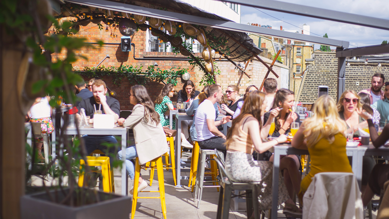 Tables of guests on the roof terrace of Big Chill King's Cross