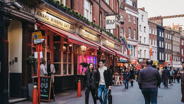 Rainbow flags hang over the entrance to Ku Bar in Soho.