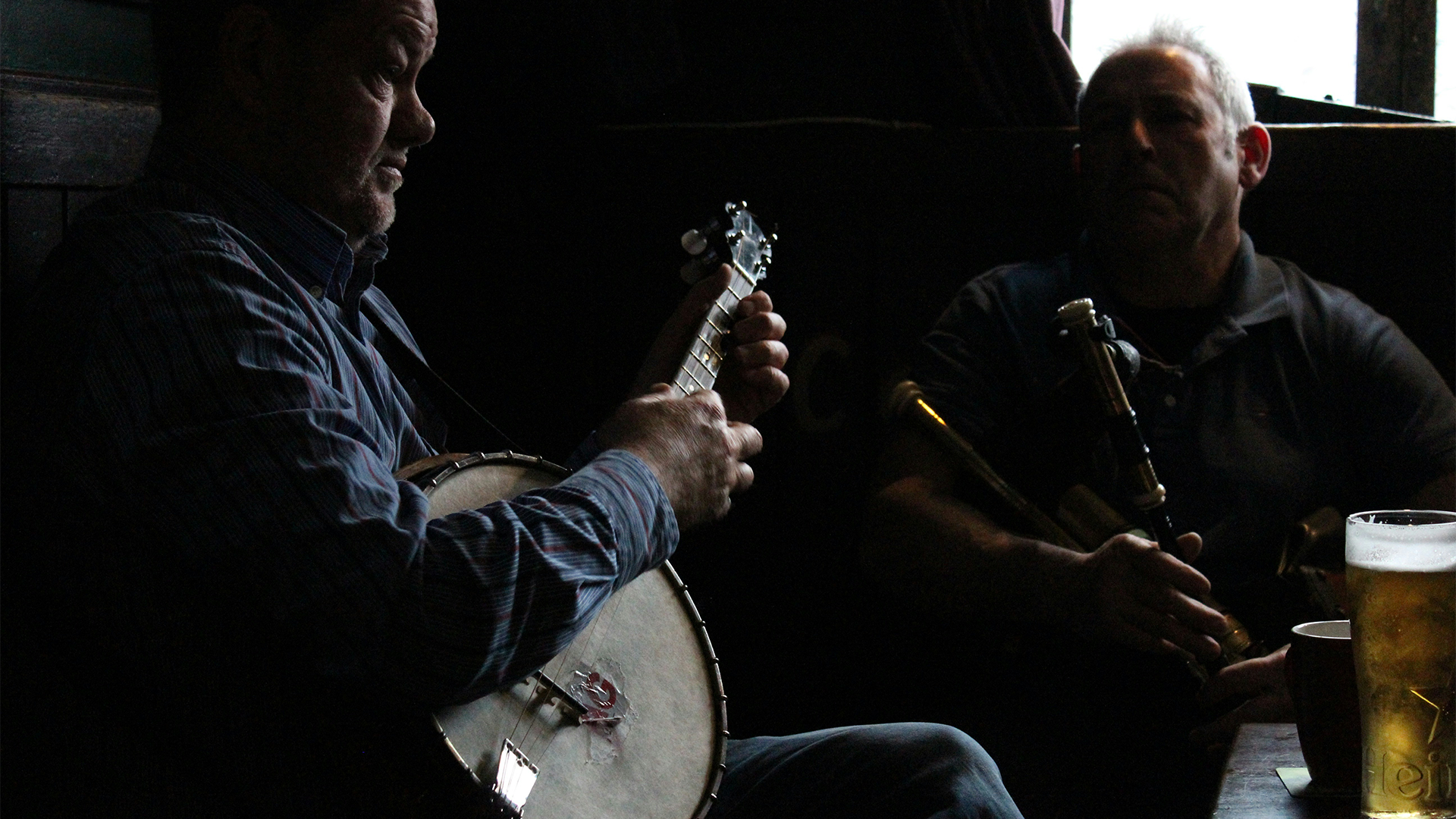 Two musicians in an Irish pub