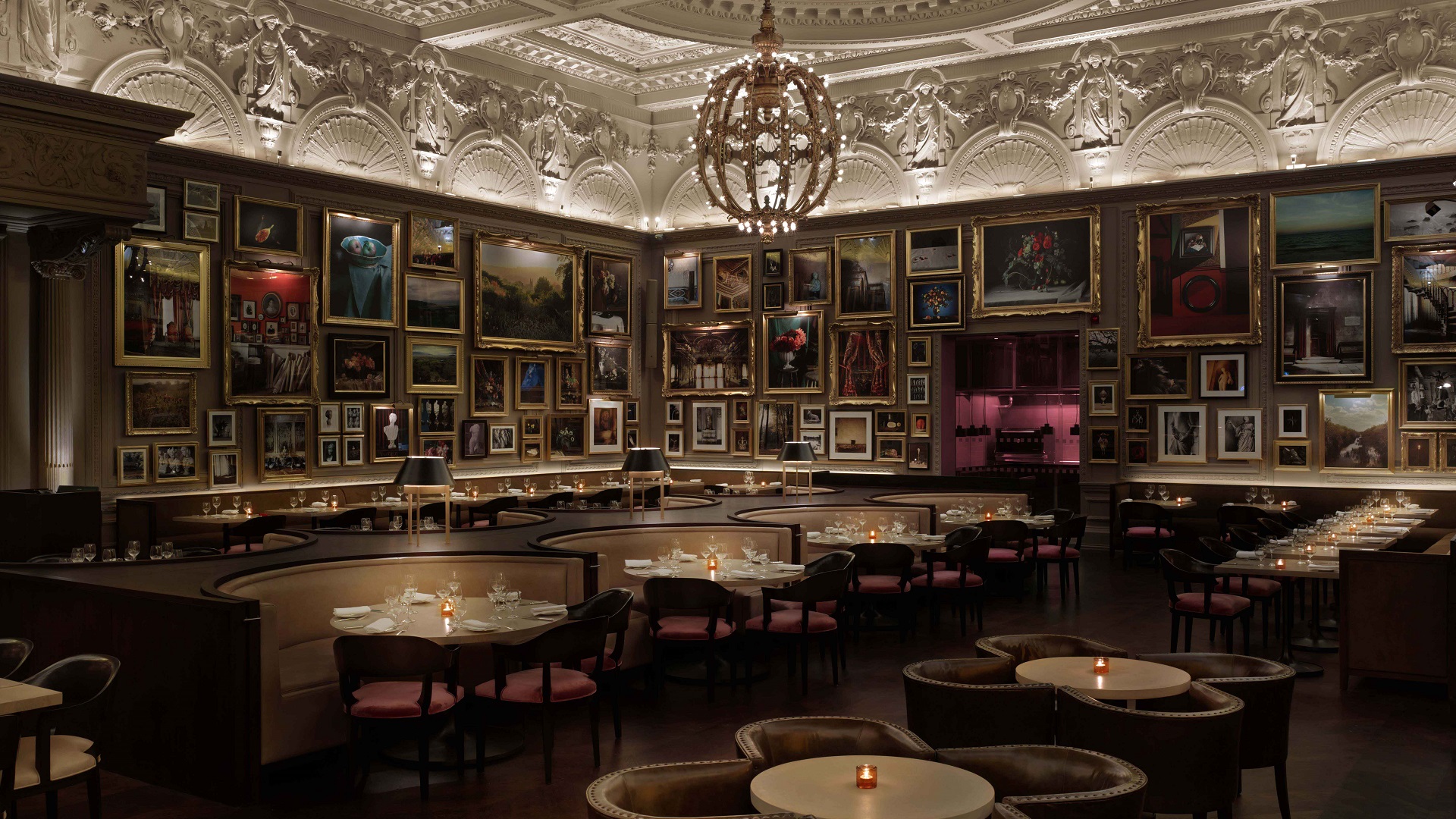 Pictures hang on the wall inside of Berners Tavern restaurant in London.