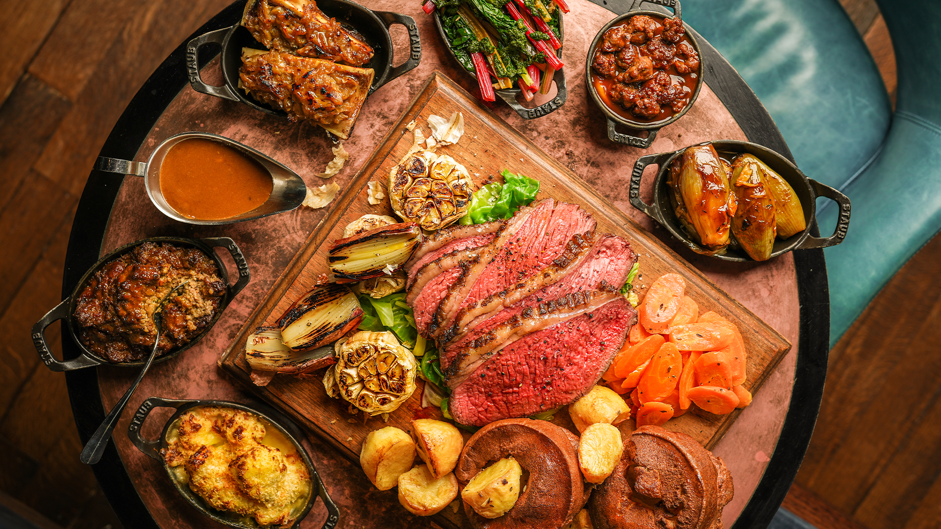 A sharing dish of Hawksmoor's Sunday roast with beef, vegetables and gravy