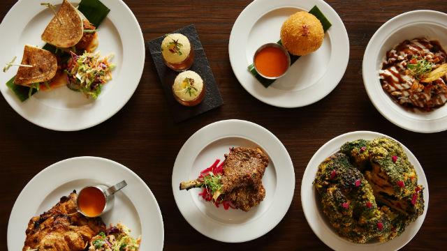 high angle image of a selection of small plates with Indian food on