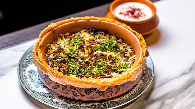 traditional indian pottery dish with a wild muntjac biryani served inside