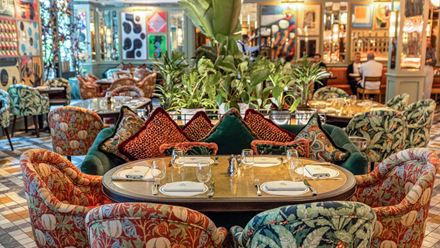 Take a seat inside the colourful dining room at The Ivy Soho Brasserie. Credit: The Ivy Collection. Image courtesy of The Ivy Collection.