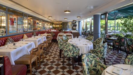 Discover a colourful setting with art adorning the walls at The Ivy Tower Bridge. Credit: The Ivy Collection. Image courtesy of The Ivy Collection.