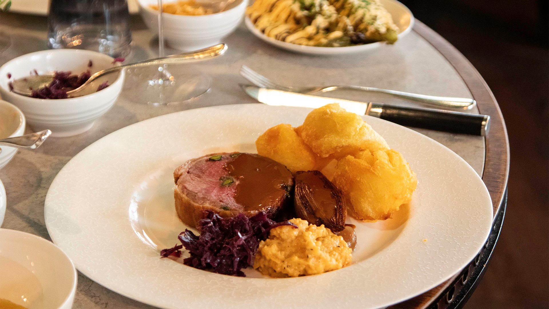 A plate with roast beef and vegetables at Kerridge's Bar & Grill