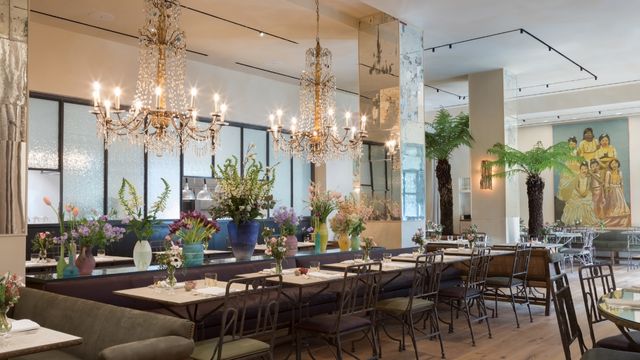 The petersham restaurant in covent garden, filled with floral arrangements interesting paintings and chandeliers.